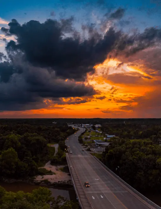 An aereal view of a highway winding through Smithfield, North Carolina at sunset